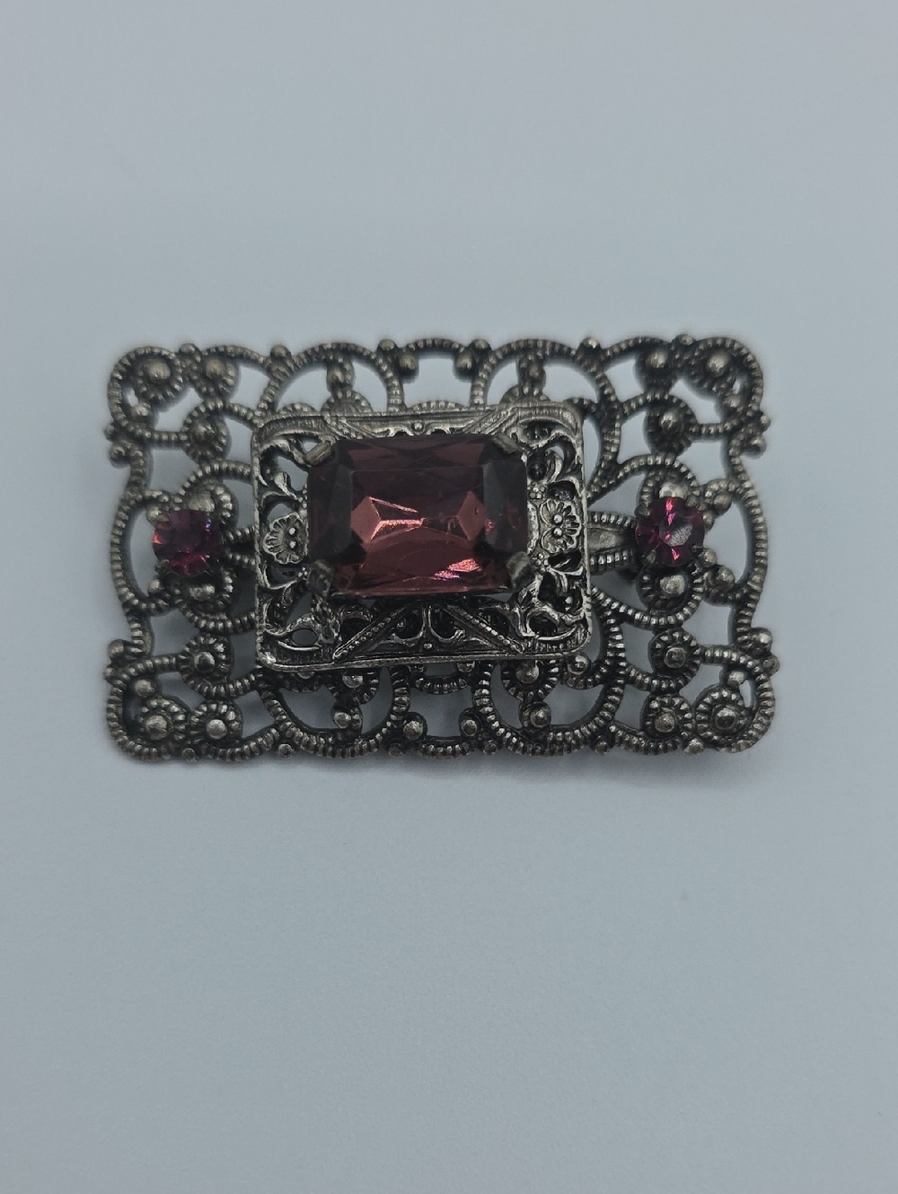 Vintage-Inspired Silver Filigree Brooch with Purple Stones